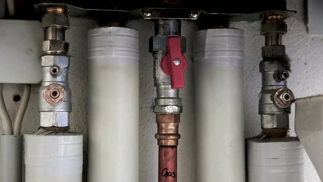  Heating installation under a water boiler with copper piping