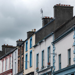 Fototapeta na wymiar Low angle view of houses in row, Dingle, Dingle Peninsula, County Kerry, Republic of Ireland