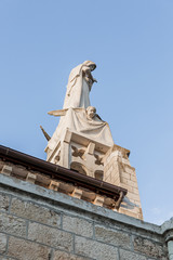 Statue of the Mother of God with a baby in her arms on the roof of the Our Lady of the Ark of the Covenant Church in the Chechen village Abu Ghosh near Jerusalem in Israel