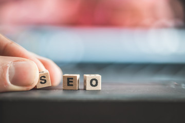 SEO Search engine optimization concept: Close up picture of wood cubes with the word “SEO”