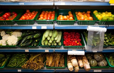 Various vegetables on shelves in grocery store