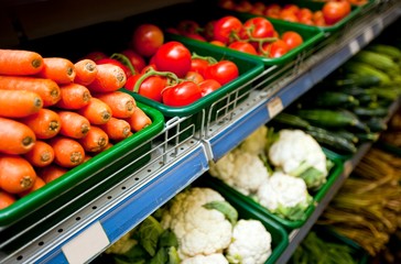 Various vegetables on display in grocery store