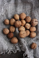 Walnuts on a grey linen background macro 