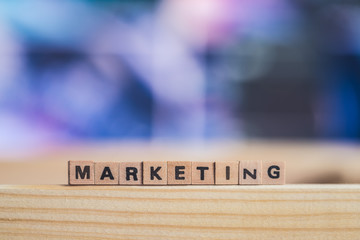Marketing and business concept: Close up picture of wood cubes with the word “marketing”