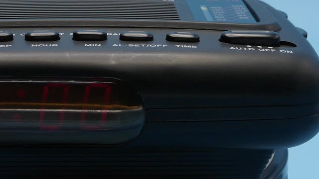 Alarm Clock Ringing Man Hitting Snooze at 5am Dolly Shot on Blue HD