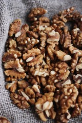 Walnuts on a grey linen background macro 