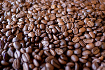 Roasted black coffee beans background.