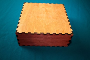 Box of plywood on a green background