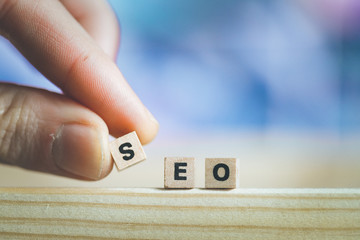 SEO Search engine optimization concept: Close up picture of wood cubes with the word “SEO”