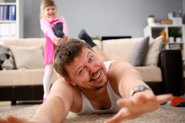 Daddy and toddler playful at hause room
