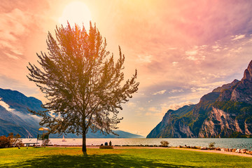 Beautiful and colorful autumn in Riva del Garda, Garda lake surrounded by mountains, Trentino Alto...