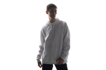 Young man in a white hoodie sweater on white background. Mock-up.
