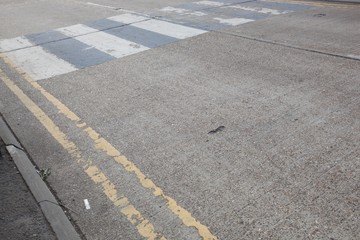 Close-Up of double yellow line on road and Zebra crossing