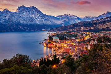 Beautiful Panorama in the Torbole a small town on Lake Garda in the winter time  at sunset, Lake Garda surrounded by mountains, Trentino Alto Adige region, Lago di garda, italy - obrazy, fototapety, plakaty