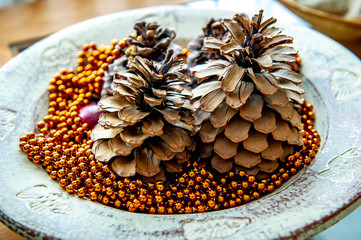 Vessel decorated with pineapples and red pearls for Christmas