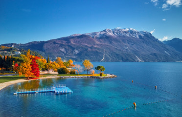 Beautiful and colorful autumn in Riva del Garda, Garda lake surrounded by mountains, Trentino Alto...