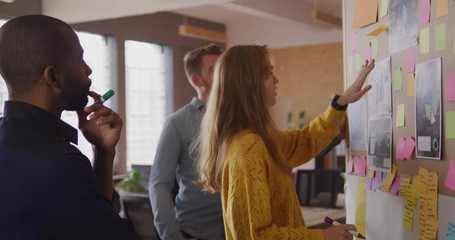 Young creative African American man professionals working in a modern office