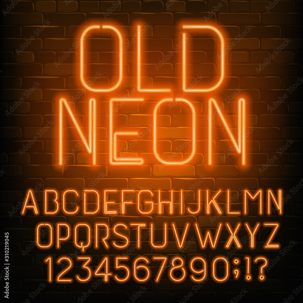 Fototapete old neon alphabet font. retro orange neon letters and numbers. brick wall background. stock vector t
