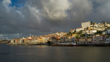 Fototapeta na wymiar City along the waterfront, Douro River, Porto, Portugal