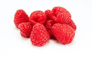 bunch of raspberries on a white background