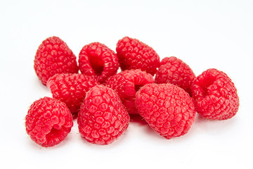 bunch of raspberries on a white background