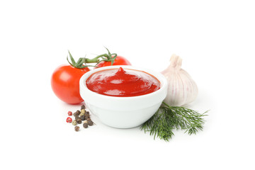 Tasty red sauce in bowl and tomatoes isolated on white background