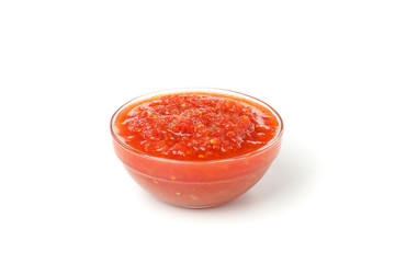 Tasty chili sauce in bowl isolated on white background