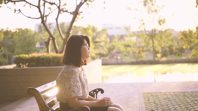 Slow motion,Asian woman sitting alone and depressed,stop abusing domestic violence, health anxiety.
