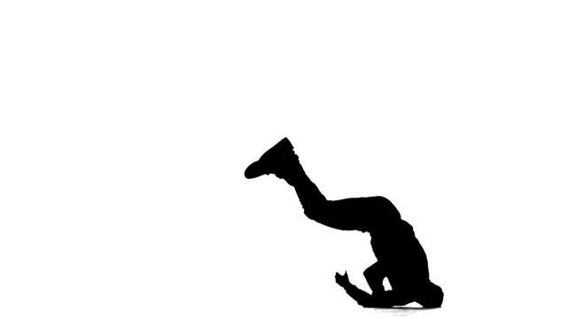 black silhouette on a white background, man dancing break dance, hip hop, street dancing in the studio, isolated