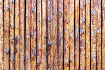 Fence made of logs. Wood Background