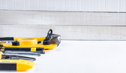 Set of yellow construction tools on white background