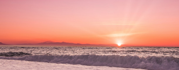 Fototapeta premium Sunset on the Mediterranean Sea with a view of Sicily.