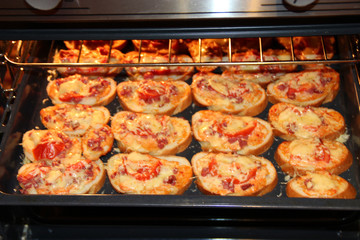 Hot sandwiches cooking in kitchen-range. Sandwiches cooking in oven