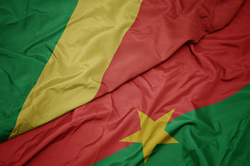 waving colorful flag of burkina faso and national flag of republic of the congo.