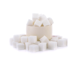 Sugar cubes in a bowl isolated on white background