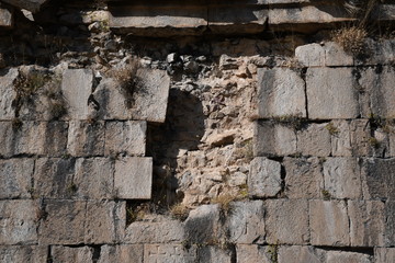wall of a medieval church in Armenia. basalt window in a medieval church. basalt background and texture. gray texture. ancient masonry walls.