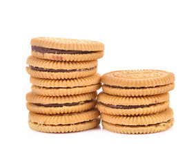 Sandwich cookie filled with chocolate cream on white