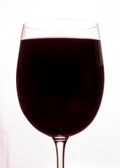  wineglass of red wine close up isolated on white blurred background. Drink close up. Cool aperitif. concept problem of alcohol addiction, alcoholism dependence