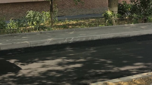 Tracked Pavers Laying Asphalt
