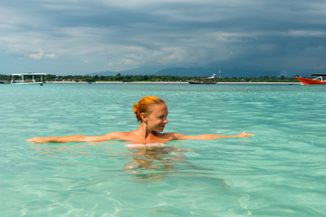 Woman at tropical island beach
