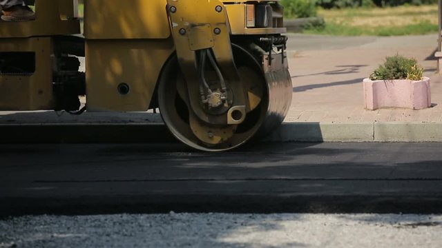 Tracked Pavers Laying Asphalt
