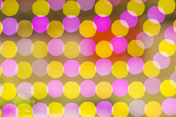 Blurred yellow pink Bokeh lights in the party as the abstract texture and background, Bokeh glitter color lights
