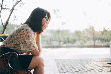 Asian woman sitting alone and depressed,stop abusing domestic violence, health anxiety.