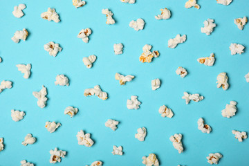 Fototapeta na wymiar popcorn on a colored background top view with place for text