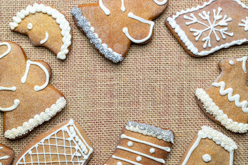 Christmas background. Handmade festive gingerbread cookies. Copy space for text. Winter holidays background mock up