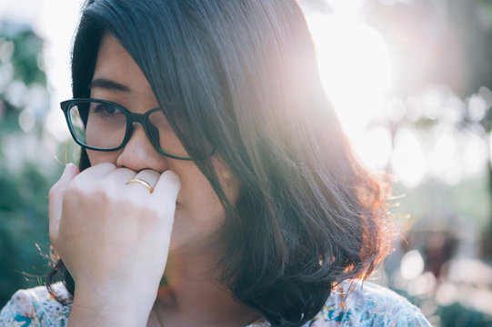 Asian Woman Sitting Alone And Depressed,stop Abusing Domestic Violence, Health Anxiety.