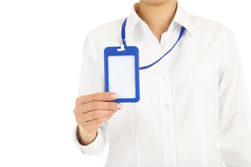Female hand showing blank bagde on white background