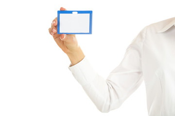 Female hand holding blank bagde on white background
