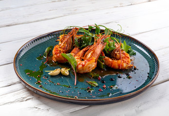 tiger prawns on a white wooden background