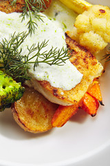 Cod Fillet with Baked Vegetables on White Restaurant Plate Isolated